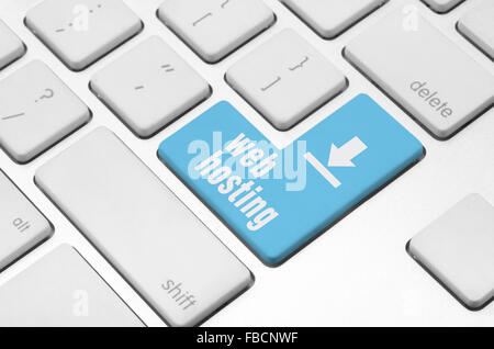 Web hosting key on the computer keyboard Stock Photo