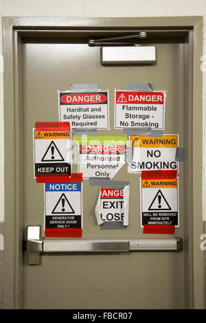 Warning Sign Convention Danger Keep Out warning sign on an external outdoors fence. Public ...