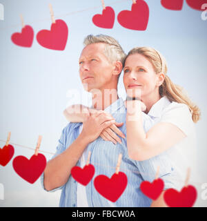 Composite image of happy couple spending time together Stock Photo