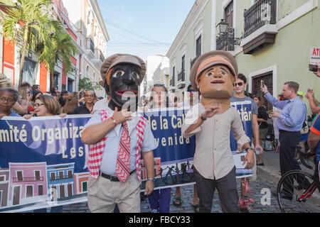 San Juan, Puerto Rico. 14th January, 2016.  Two masked men marches in the street at the San Sebastian Street Festival. Maria S./Alamy Live News Stock Photo