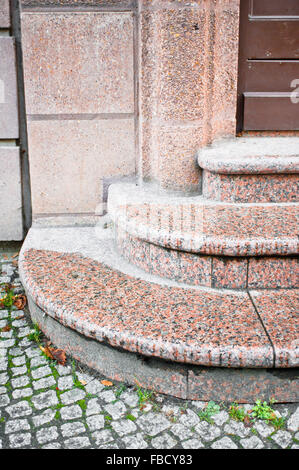 Part of a set of entrance steps made out of granite stone Stock Photo