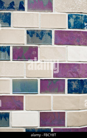 Pastel toned tiles on a wall as a background Stock Photo