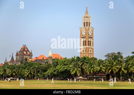 MUMBAI, INDIA - OCTOBER 10, 2015: Unidentified people playing sqiash by the Rajabai Clock Tower in Mumbai. Tower was completed a Stock Photo