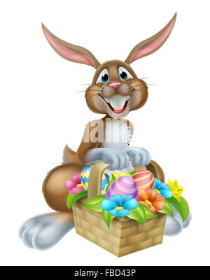 Cartoon Easter bunny rabbit holding an Easter basket full of chocolate painted Easter eggs Stock Photo