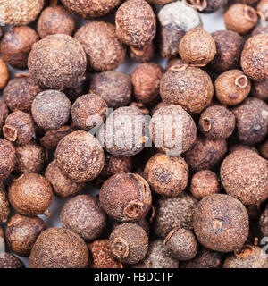 square food background - jamaica pepper berries (allspice) close up Stock Photo