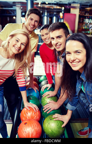 happy friends in bowling club Stock Photo