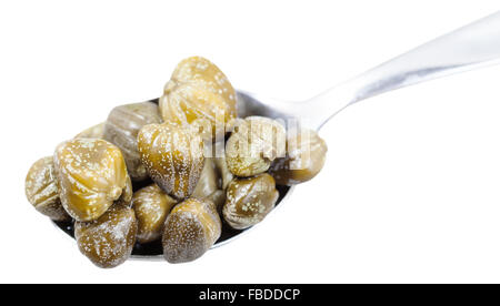 pickled capers in spoon isolated on white background Stock Photo