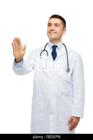 smiling male doctor touching something Stock Photo