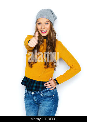 happy young woman or teen girl showing thumbs up Stock Photo