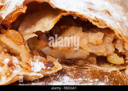 apple and raisins sweet filling in traditional viennese apple strudel close up Stock Photo