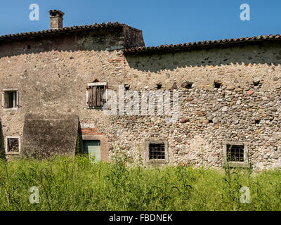 Old abandoned stone house in the Italian hills. Stock Photo
