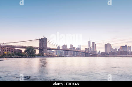 Brooklyn Bridge and Manhattan in rose quartz and serenity colors, New York, USA. Stock Photo