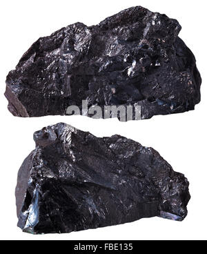 macro shooting of specimen natural rock - two pieces of black anthracite (coal) mineral stone isolated on white background Stock Photo