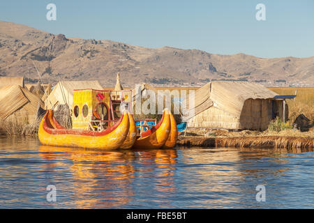 Reed boat on Island of Uros. Those are floating islands on lake Titicaca located between Peru and Bolivia. Colorful image with y