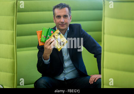 Chairman of the management board of chocolate manufacturer Ritter Sport, Andreas Ronken, holds chocolate bars with different flavours in his hand at the company headquarter in Waldenbuch, Germany, 8 December 2015. Photo: Daniel Maurer/dpa Stock Photo