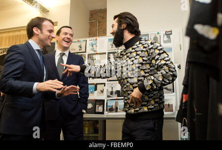 Berlin, Germany. 14th Jan, 2016. French Economy Minister Emmanuel Macron (l-r) and British Chancellor of the Exchequer George Osborne speaking to Ashley Marc Hovelle during a visit to Factory in Berlin, Germany, 14 January 2016. PHOTO: JOERG CARSTENSEN/DPA/Alamy Live News Stock Photo