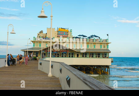 Daytona Beach Florida famous Main Street Pier and Boardwalk pier with restaurant Joes Crab Shack on water for tourists with boar Stock Photo