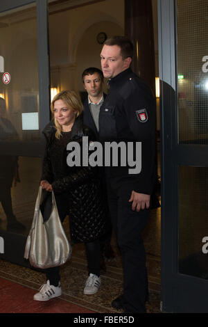 Hamburg, Germany. 15th Jan, 2016. German singer Annett Louisan accompanied by a judicial officer into the courtroom of the house of Criminal Justice in Hamburg, Germany, 15 January 2016. The trial of an alleged extortionist of the singer has begun before the Hamburg District Court in the presence of the singer. A 42-year-old man has been accused of threatening the singer after having contacted her initially on Facebook last April, threatening her and demanding money from her. Photo: CHRISTIAN CHARISIUS/dpa/Alamy Live News Stock Photo