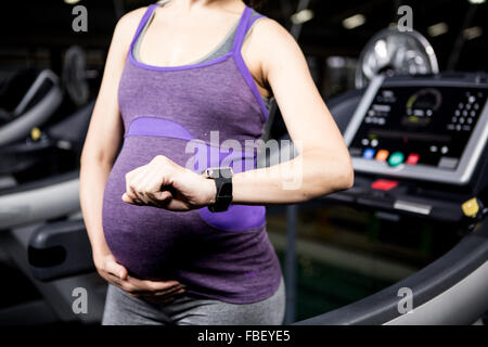 Pregnant woman with smart watch Stock Photo