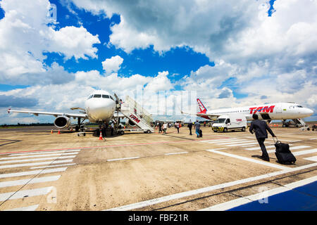 Passengers boarding Tam Airlines Airbus 320 airplane at Cataratas International Airport in Foz do Iguacu, Parana, Brazil. Stock Photo