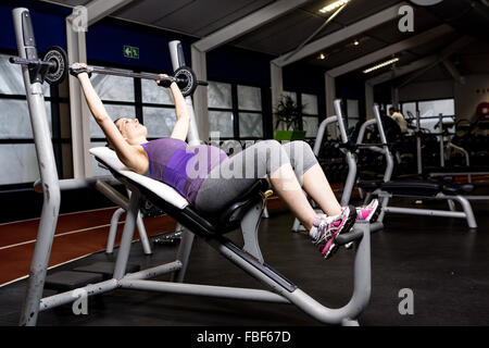 Pregnant woman working out Stock Photo