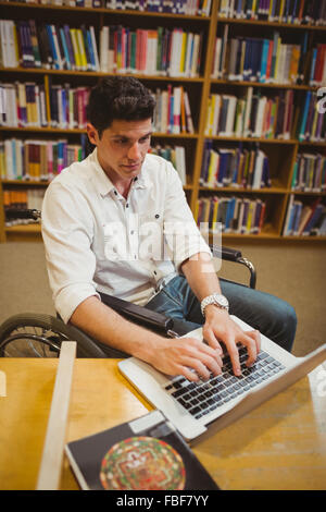 Student in wheelchair typing on his laptop Stock Photo