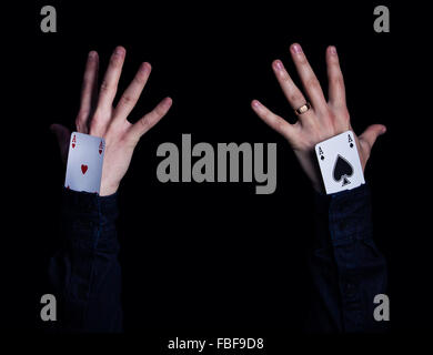 two human hands with aces in sleeve Stock Photo