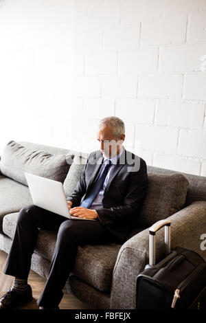 Businessman using laptop Stock Photo
