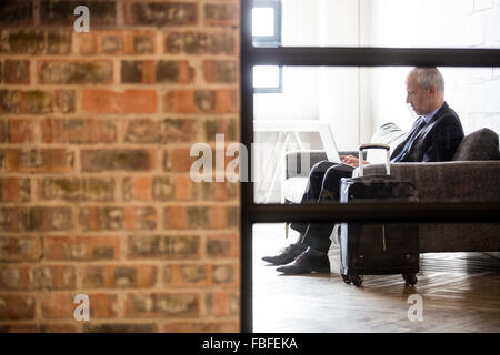 Businessman using laptop Stock Photo