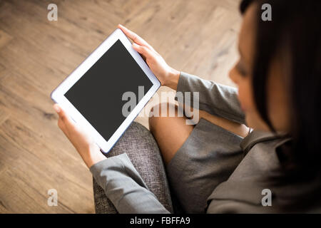Businesswoman using tablet Stock Photo