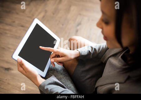 Businesswoman using tablet Stock Photo