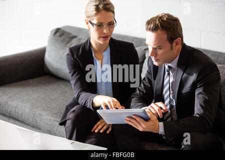 Businessmen using tablet Stock Photo