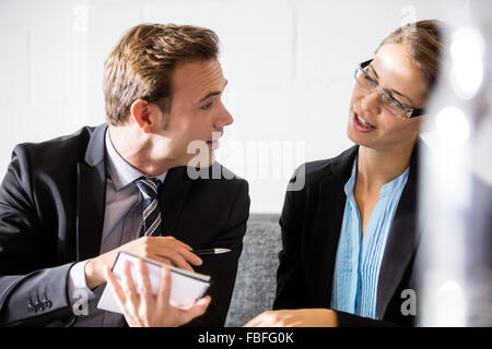 Colleagues talking together Stock Photo