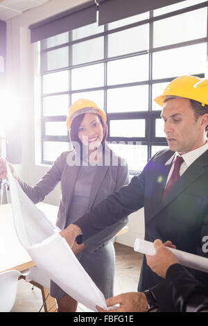 Business people wearing safety helmets Stock Photo