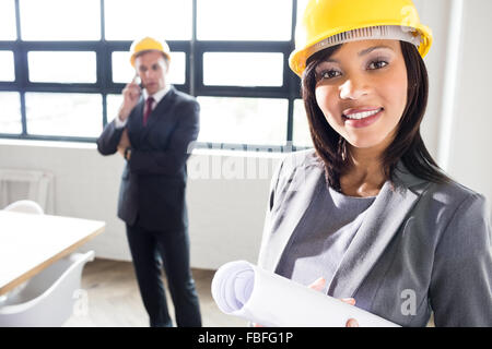 Business people wearing safety helmets Stock Photo