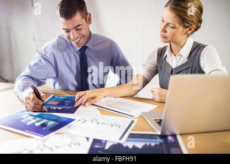 Smiling business people working together Stock Photo