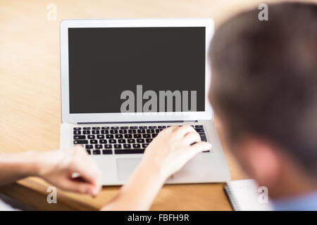 Business people working together while using laptop Stock Photo