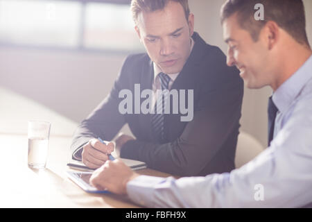 Focused business people working together Stock Photo