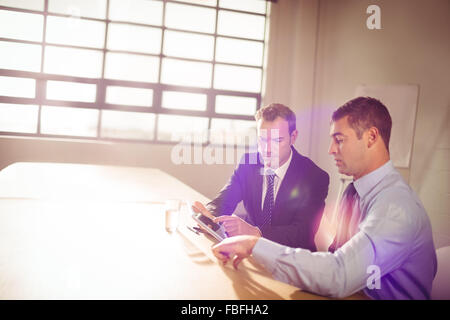 Focused business people working together Stock Photo