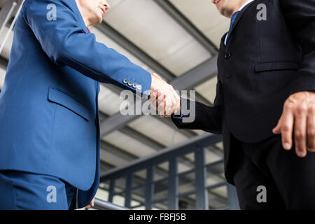 Two smiling businessmen shaking hands Stock Photo