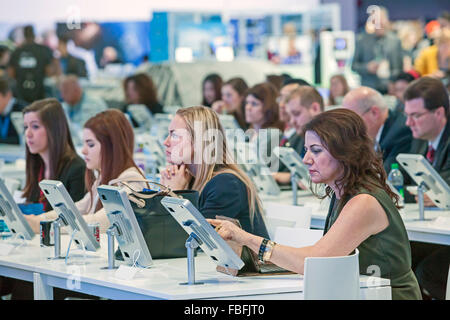 Detroit, Michigan - People listen to a presentation at the Ford display at the North American International Auto Show. Stock Photo