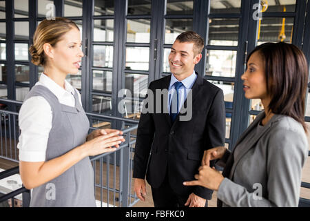 Serious business people talking together Stock Photo