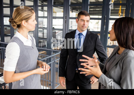 Smiling business people talking together Stock Photo