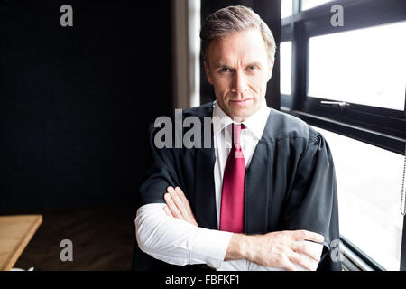 Serious lawyer looking at the camera Stock Photo