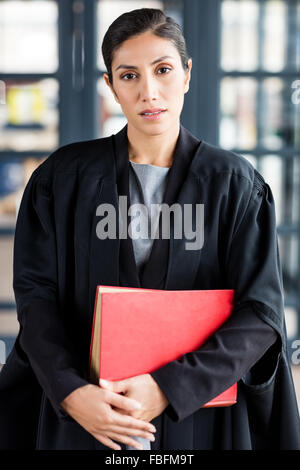 Female lawyer holding a red book Stock Photo