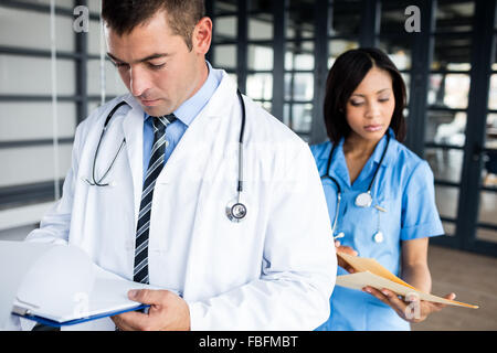 Nurse and doctor looking at files Stock Photo