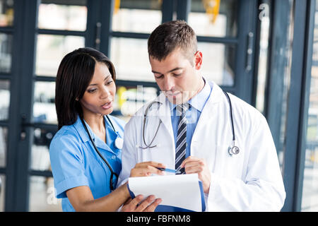 Nurse and doctor looking at files Stock Photo