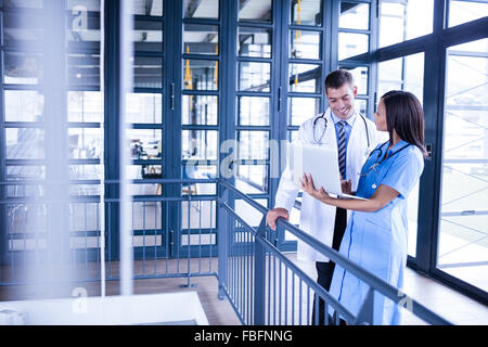 Nurse and doctor looking at a laptop Stock Photo