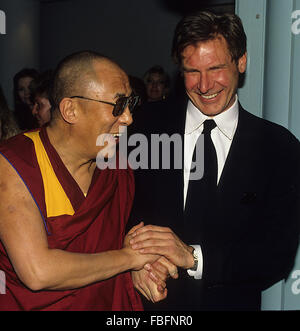 Washington, DC., USA,  1993  The Dalai Lama with Harrison Ford in Washington DC.  Harrison Ford  is an American film actor and producer. He is famous for his performances as Han Solo in the original Star Wars trilogy and the title character of the Indiana Jones film series. Ford is also known for his roles as Rick Deckard in Blade Runner, John Book in Witness and Jack Ryan in Patriot Games and Clear and Present Danger. His career has spanned six decades and includes roles in several Hollywood blockbusters Credit: Mark Reinstein Stock Photo