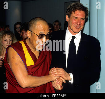Washington, DC. , USA, 1993 The Dalai Lama with Harrison Ford in Washington DC.  Harrison Ford  is an American film actor and producer. He is famous for his performances as Han Solo in the original Star Wars trilogy and the title character of the Indiana Jones film series. Ford is also known for his roles as Rick Deckard in Blade Runner, John Book in Witness and Jack Ryan in Patriot Games and Clear and Present Danger. His career has spanned six decades and includes roles in several Hollywood blockbusters Credit: Mark Reintein Stock Photo
